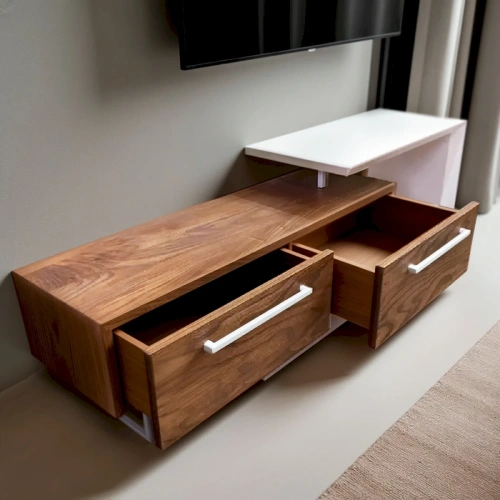 Тумба в интерьере с телевизором и декоративными элементами с открыми ящиками