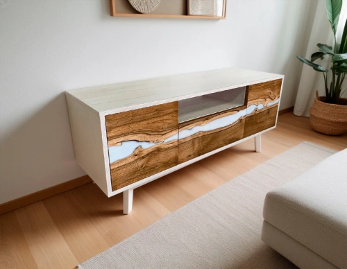 Низкая длинная тумба под телевизор из массива грецкого ореха с вставками из белой эпоксидной смолы в интерьере гостиной