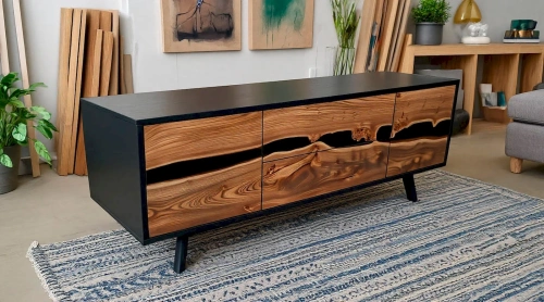 Дизайнерские наклонные ножки и черная столешница тумбы под ТВ из массива дерева