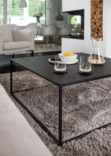 Журнальный черный столик MyOry Strong Steel в современном интерьере гостиной