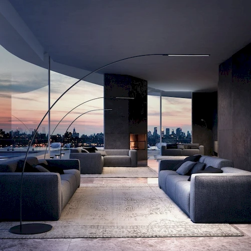 Торшер ArcLarge с нейтральным светом 4000K над диванами в зоне отдыха гостиницы