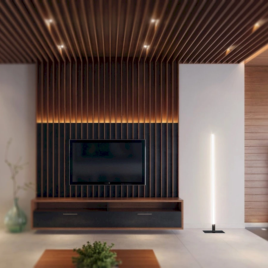 Торшер LightSabre с вертикальным LED модулем и стеклом с трещинами стоит у тумбы TV в светлой гостиной